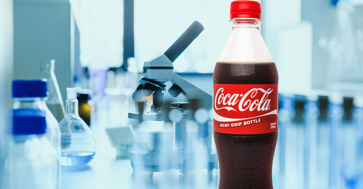 CocaCola bottle and medical equipment in laboratory