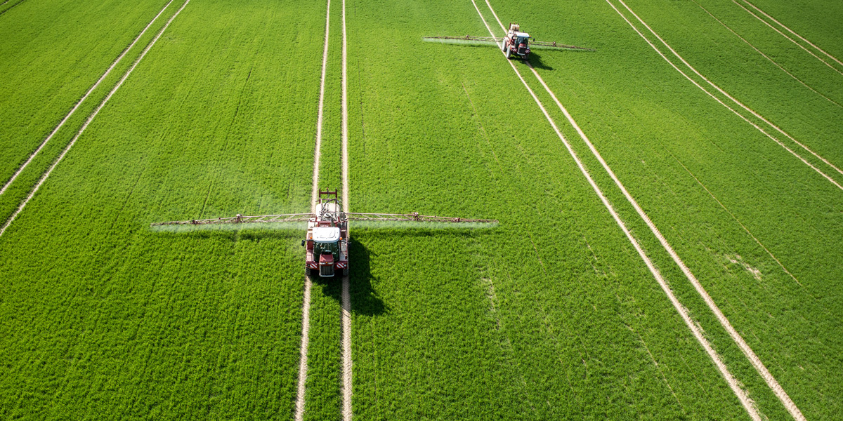 Aerial view of the tractor pesticide spraying