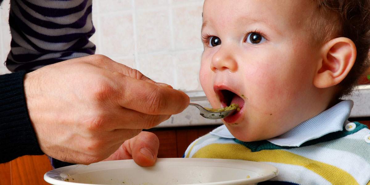 Baby being fed