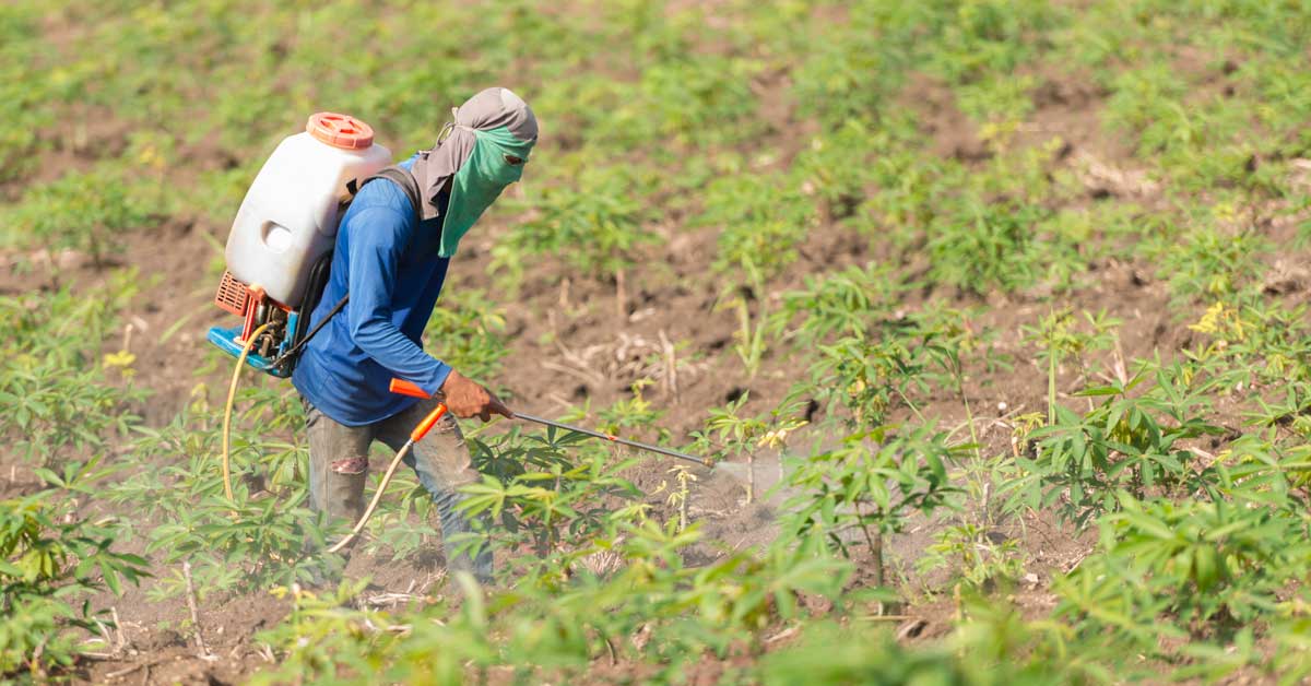 Farmer spraying herbicides
