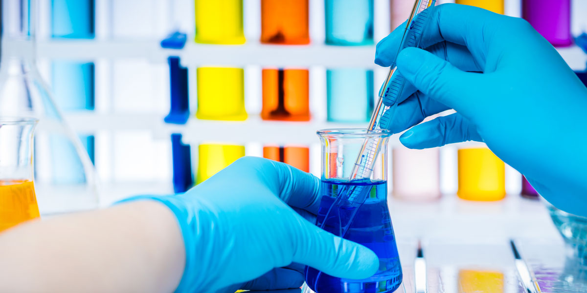 Laboratory worker holds a flask