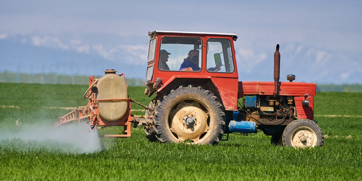 Tractor spraying pesticides