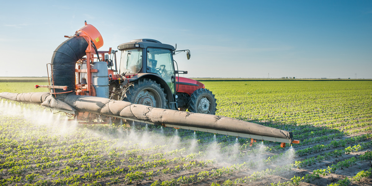 Tractor spraying pesticides